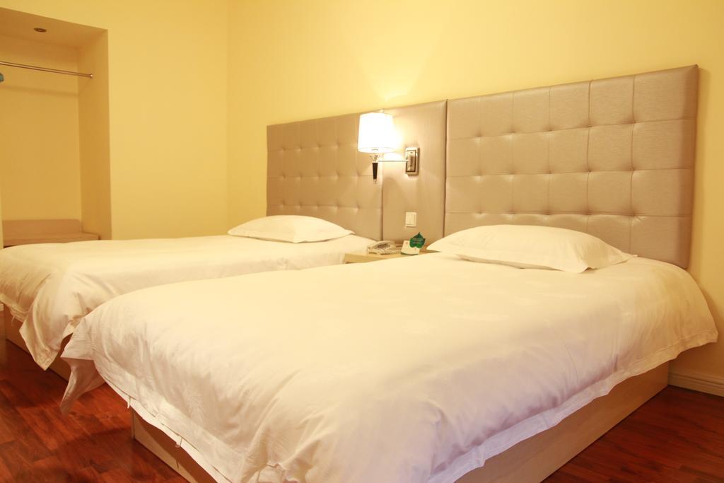 Qingdao Renjia Bussiness Hotel Kamer foto